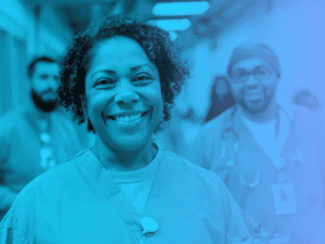 A blue duotone image of a smiling female nurse of color in a correctional facility