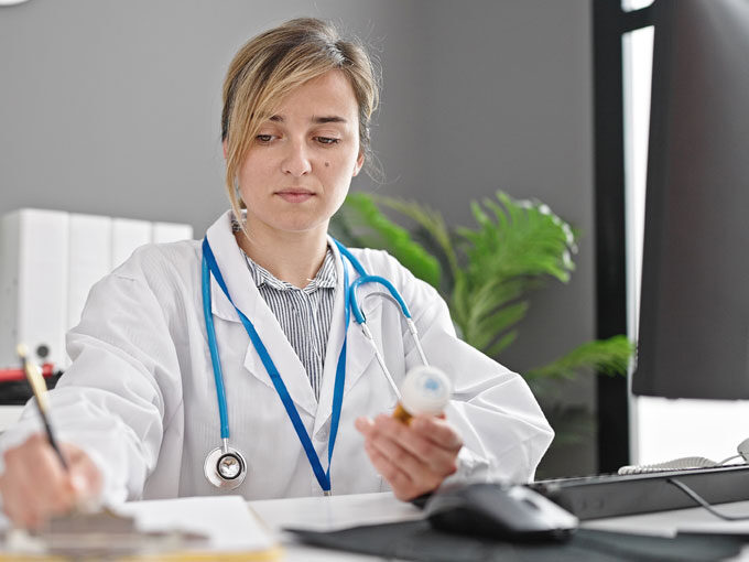 physician writing an order