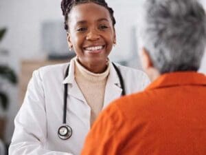 correctional physician with patient